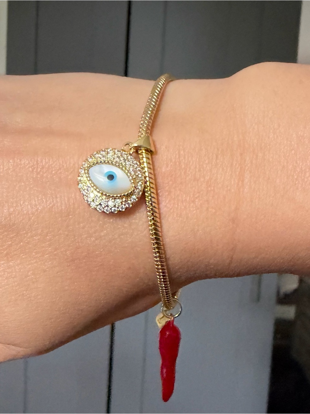 Gold Evil Eye Charm Bracelet with Red Horn Accent
